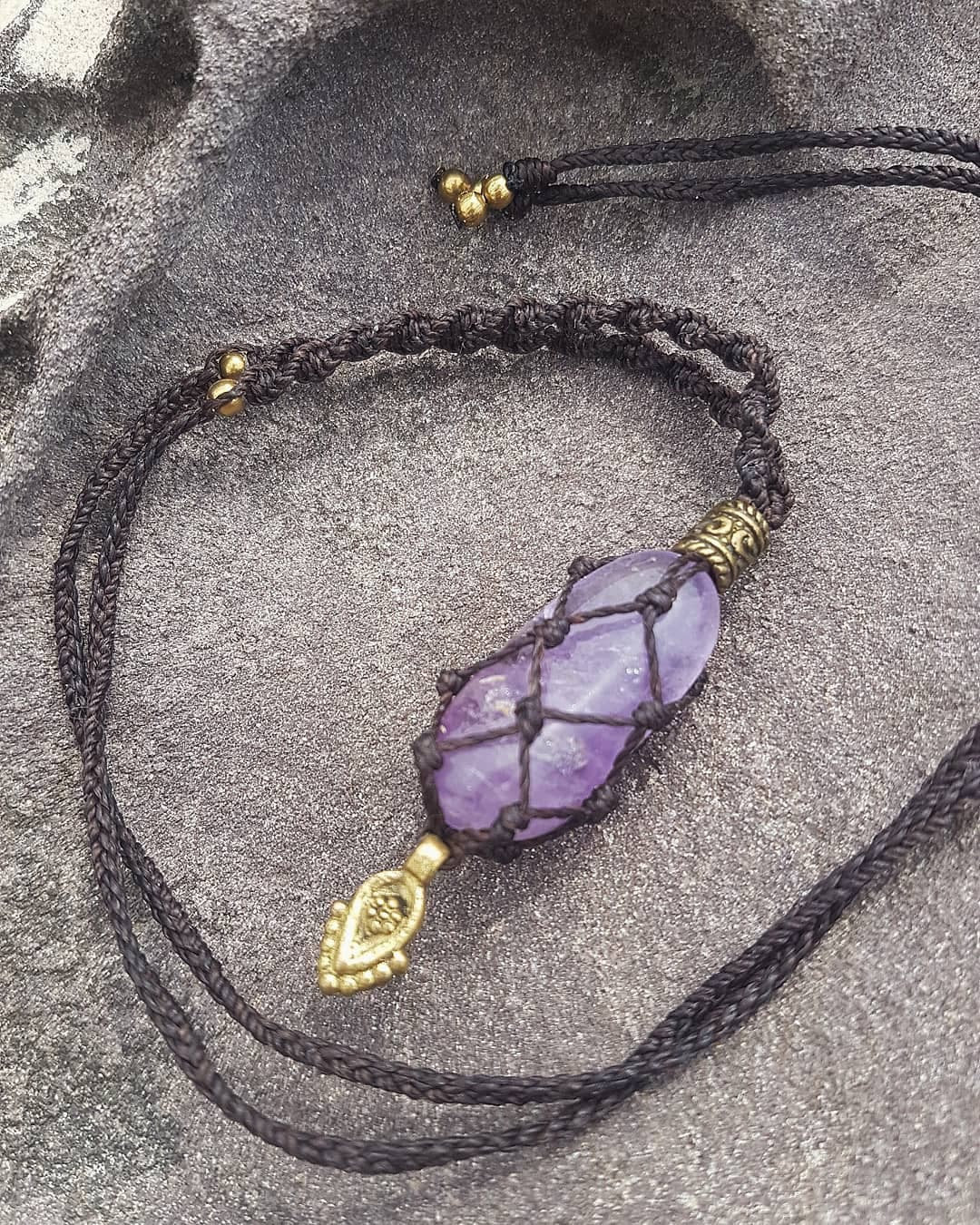 Amethyst crystal macrame necklace with brown cord and brass beads