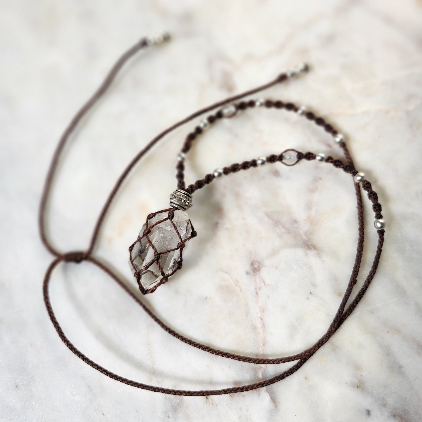 Quartz point crystal handmade macrame necklace with red/brown cord and silver beads