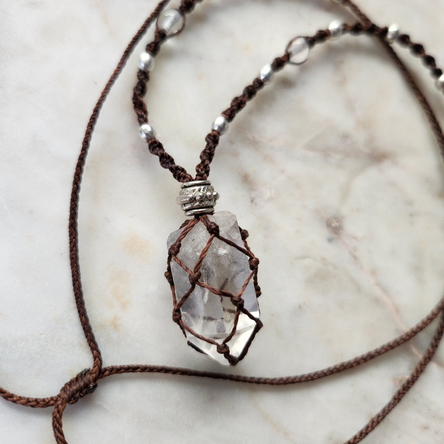 Quartz point crystal handmade macrame necklace with red/brown cord and silver beads